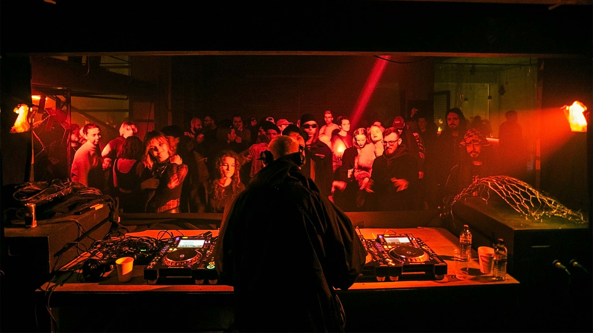 A DJ performing at a club night